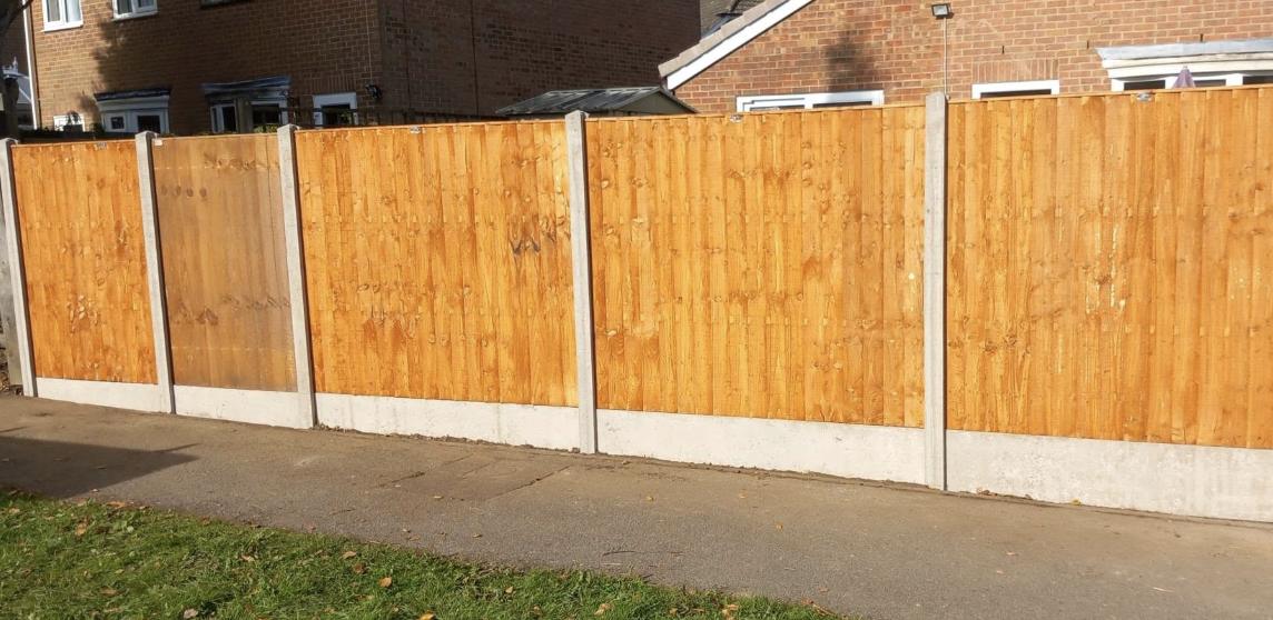 Street facing closeboard fencing on concrete posts and gravel boards
