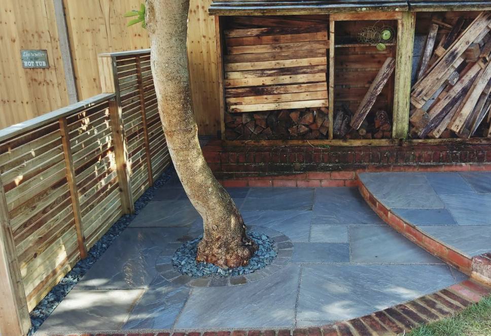 Timber decking and slatted screen built around a mature tree
