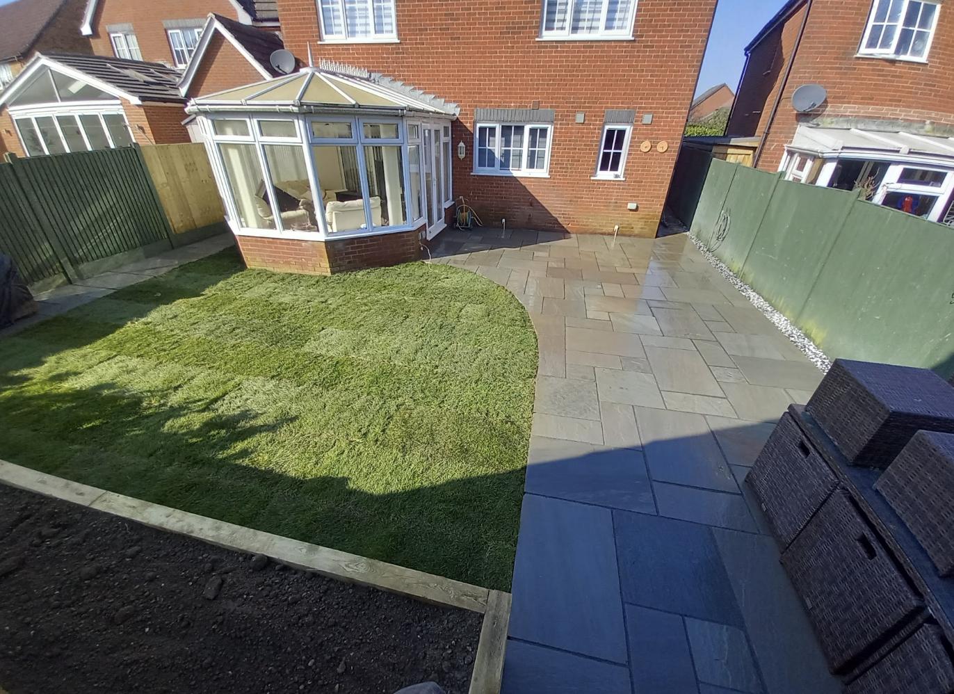 Completed garden renovation with new lawn, patio and planting