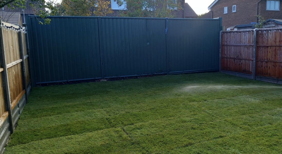 New porcelain patio path and fresh lawn installed by Lawn Ranger Landscapes