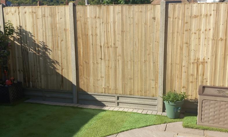 Lawn Ranger Landscapes landscaper on the tools installing fencing